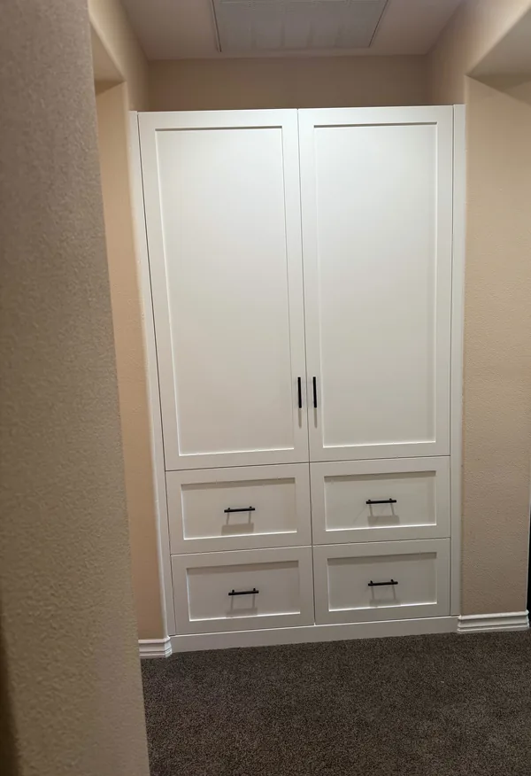 Tall white shaker linen cabinet with doors over drawers, Newbury Park