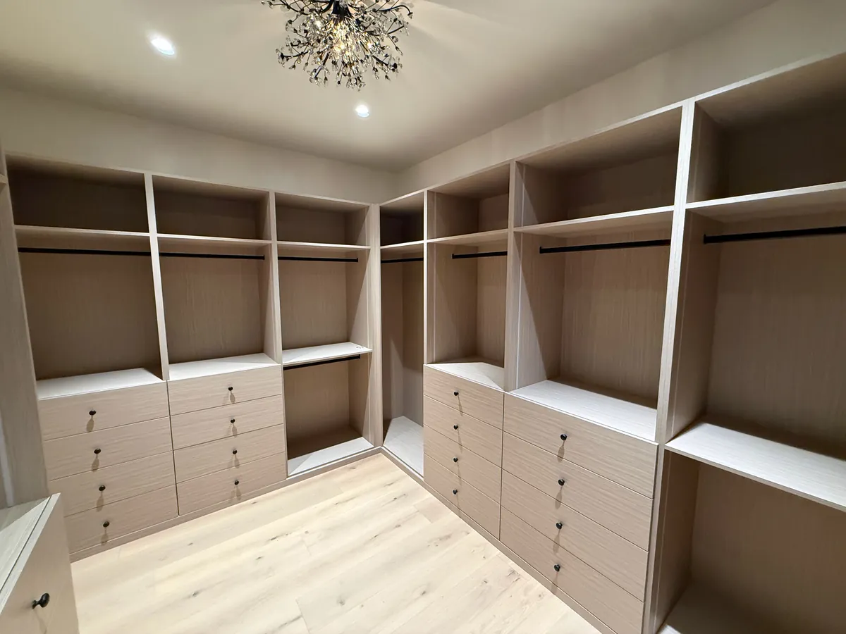 Custom walk-in closet with drawer banks, open shelving and hanging rods, Thousand Oaks