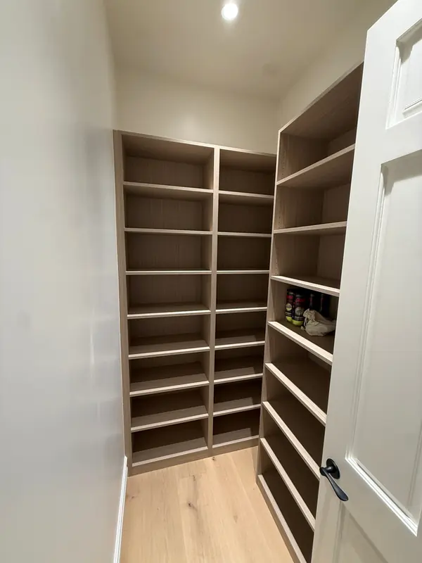 Walk-in closet lined with floor-to-ceiling open shelving, Thousand Oaks