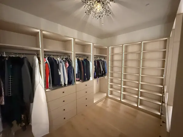 Custom walk-in closet with LED-lit shelving, drawers and hanging sections, Thousand Oaks