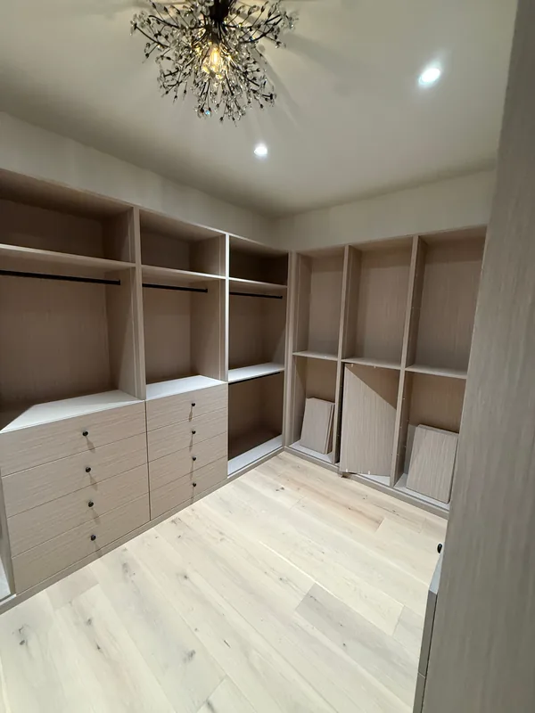 Walk-in closet with drawer stacks, open shelving and hanging sections, Lake Sherwood