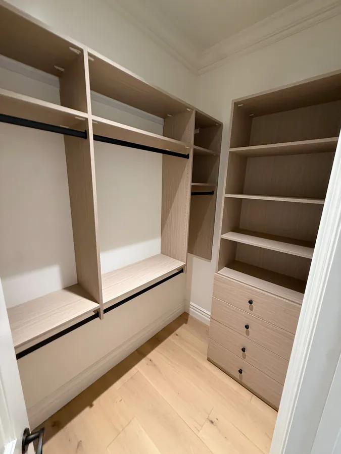 Closet with double hanging rods, open shelves and a drawer stack with black knobs, Thousand Oaks