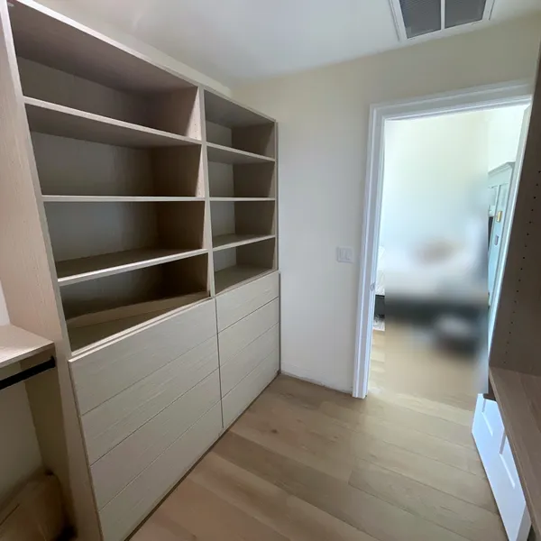 KML Palomino shelving tower above a bank of drawers in a master walk-in closet, Thousand Oaks