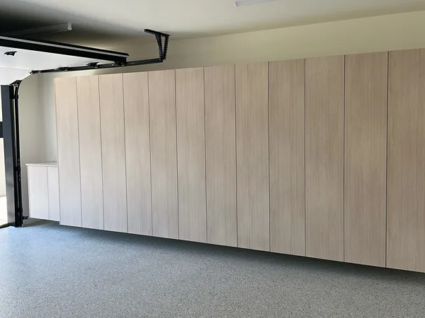 Wall of full-height light wood garage cabinets beside the garage door, Westlake Village