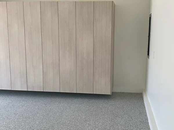 Light wood flat-panel garage cabinets mounted above the floor, Westlake Village