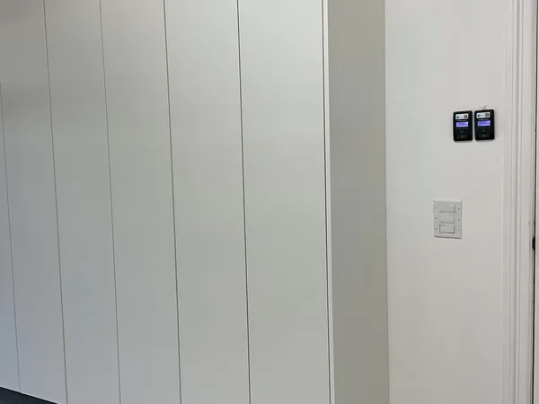Tall white flat-panel storage tower in the corner of a garage, Hidden Hills