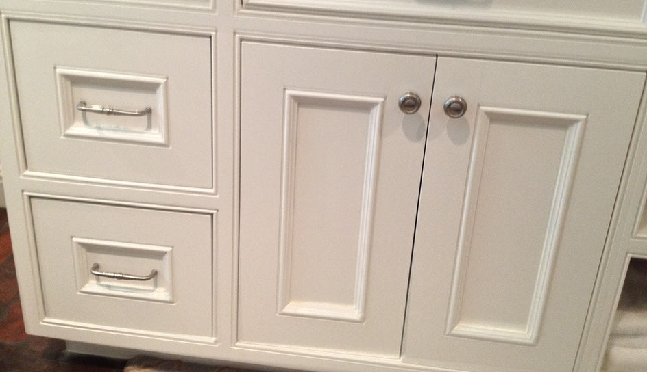 Beaded Inset Paint Grade Bathroom Vanity with a Swiss Coffee Lacquer Finish