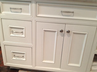 Beaded Inset Paint Grade Bathroom Vanity with a Swiss Coffee Lacquer Finish