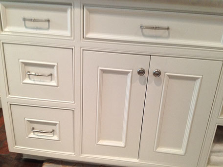 Beaded Inset Paint Grade Bathroom Vanity with a Swiss Coffee Lacquer Finish