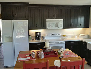 Frameless Alder Kitchen with Shaker Style doors with a Merlot Lacquer Finish