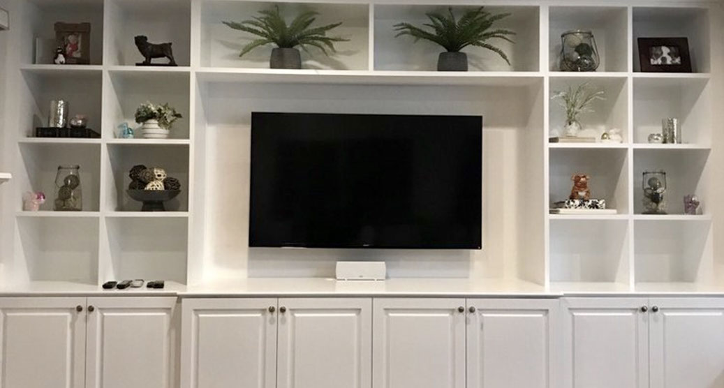 Traditional Paint Grade Entertainment Center with an Antique White Lacquer Finish