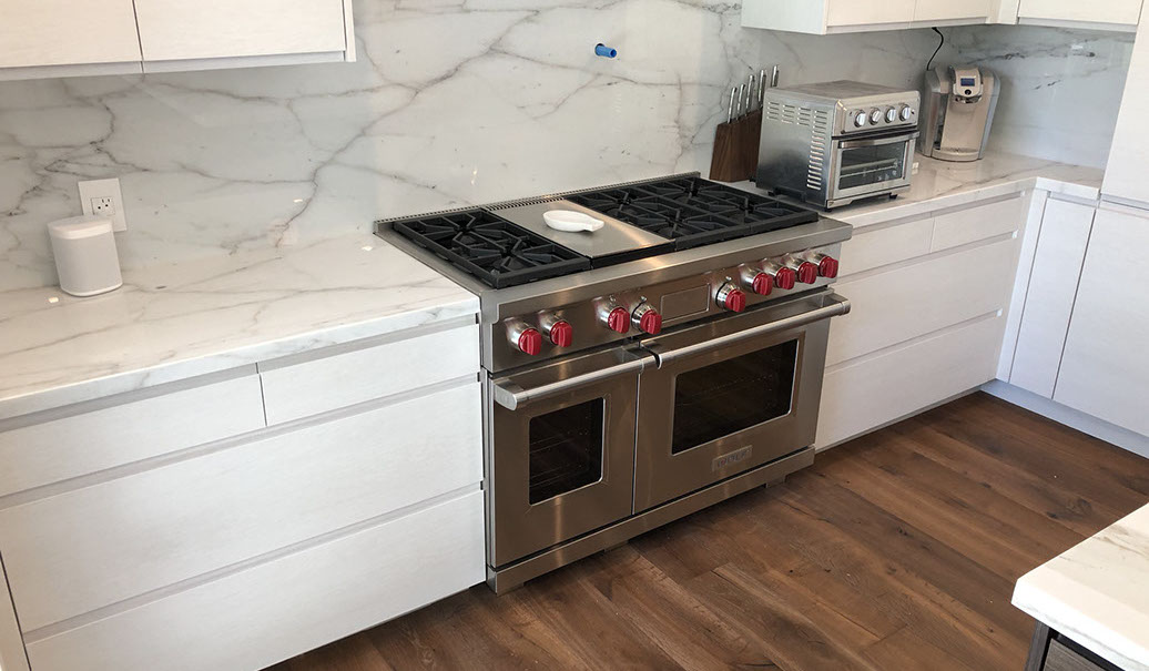 Frameless Alder Kitchen with Shaker Style doors with a Merlot Lacquer Finish