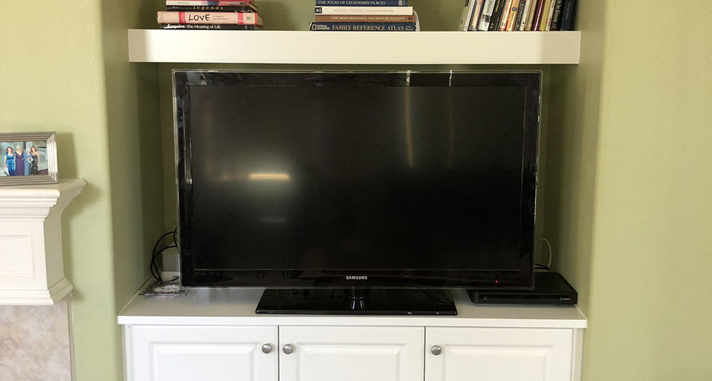 Traditional Paint Grade Entertainment Center with an Antique White Lacquer Finish