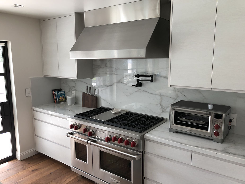 Frameless Alder Kitchen with Shaker Style doors with a Merlot Lacquer Finish