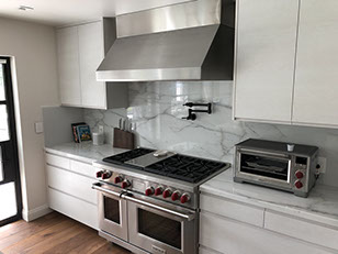 Frameless Alder Kitchen with Shaker Style doors with a Merlot Lacquer Finish