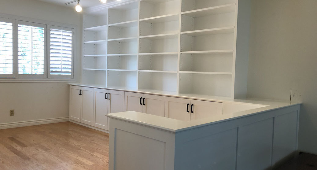 Traditional Paint Grade Entertainment Center with an Antique White Lacquer Finish