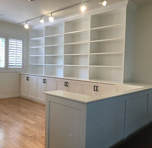 Traditional Paint Grade Entertainment Center with an Antique White Lacquer Finish