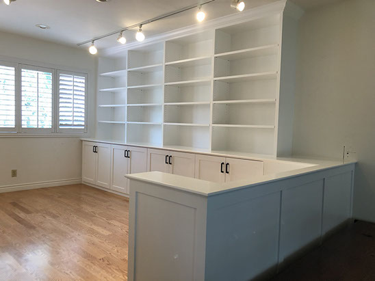 Traditional Paint Grade Entertainment Center with an Antique White Lacquer Finish