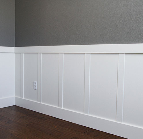 Custom Paint Grade Wainscoting and Crown Molding with a Swiss Coffee Lacquer Finish.