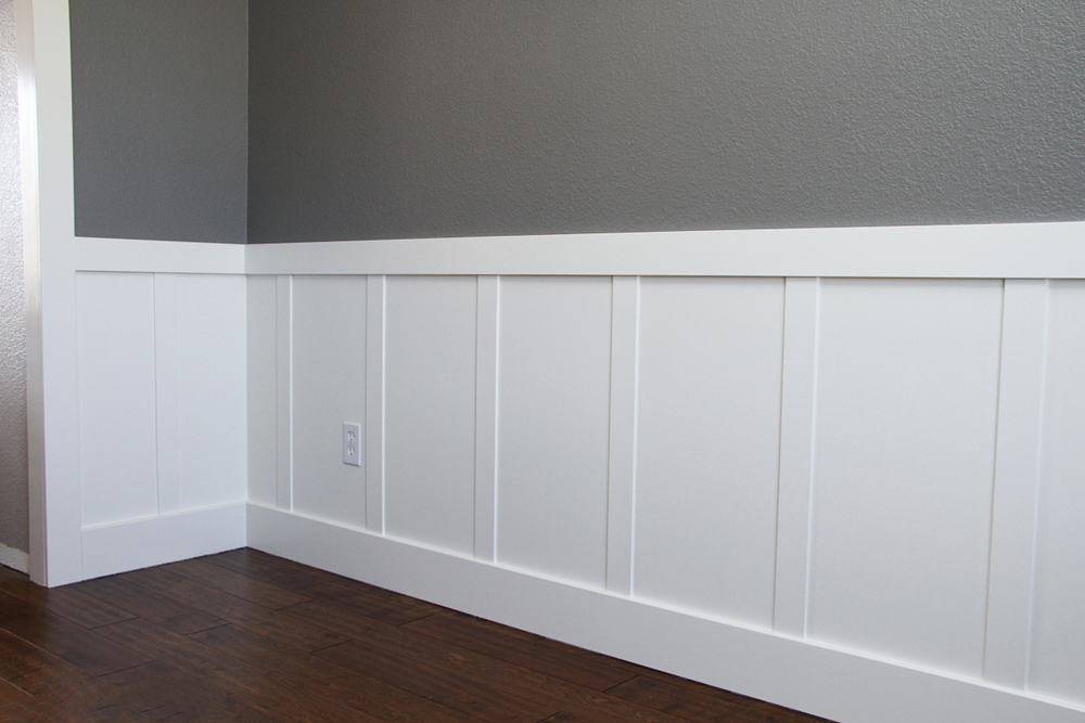 Custom Paint Grade Wainscoting and Crown Molding with a Swiss Coffee Lacquer Finish.