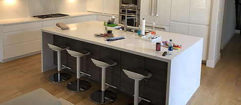 Frameless Alder Kitchen with Shaker Style doors with a Merlot Lacquer Finish