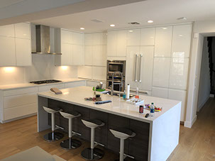 Frameless Alder Kitchen with Shaker Style doors with a Merlot Lacquer Finish
