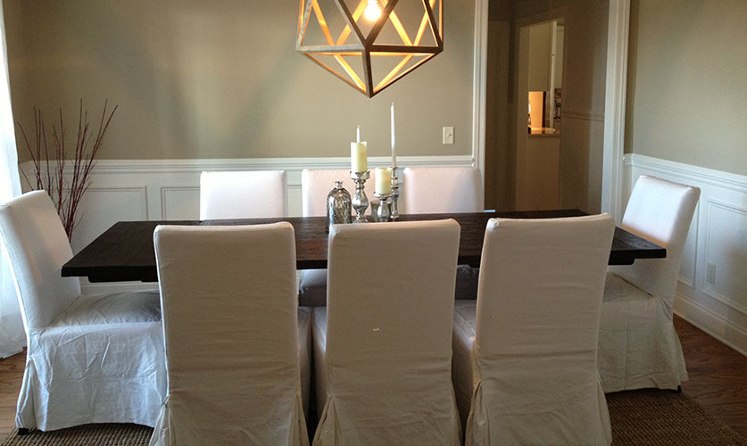 Custom Paint Grade Wainscoting and Crown Molding with a Swiss Coffee Lacquer Finish.