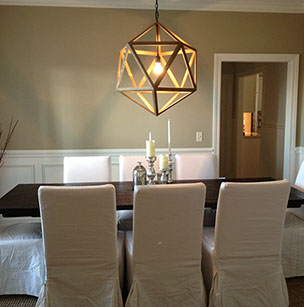 Custom Paint Grade Wainscoting and Crown Molding with a Swiss Coffee Lacquer Finish.