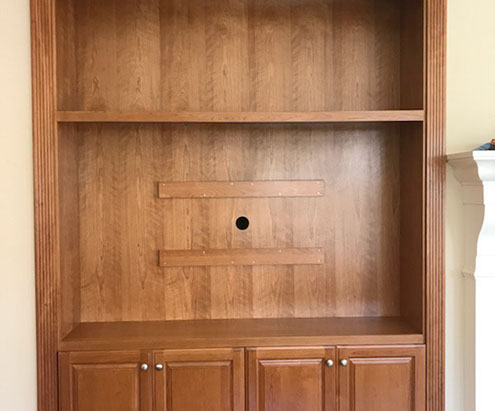 Traditional Paint Grade Entertainment Center with an Antique White Lacquer Finish