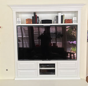 Traditional Paint Grade Entertainment Center with an Antique White Lacquer Finish