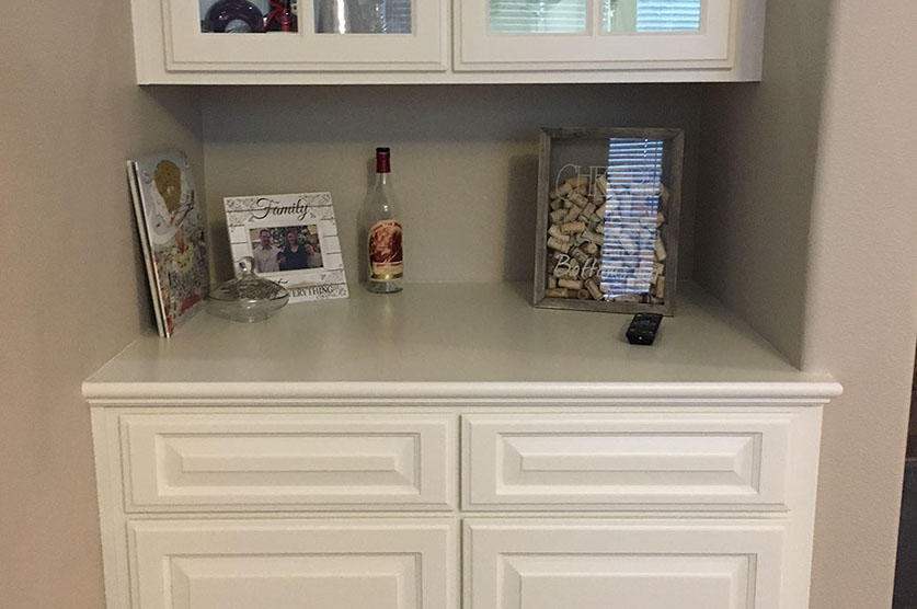 Traditional Paint Grade Entertainment Center with an Antique White Lacquer Finish