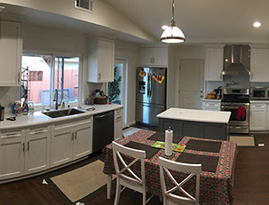 Frameless Alder Kitchen with Shaker Style doors with a Merlot Lacquer Finish