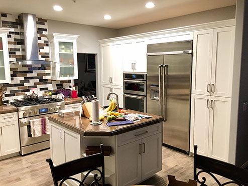 Frameless Alder Kitchen with Shaker Style doors with a Merlot Lacquer Finish