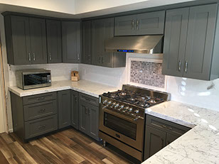 Frameless Alder Kitchen with Shaker Style doors with a Merlot Lacquer Finish
