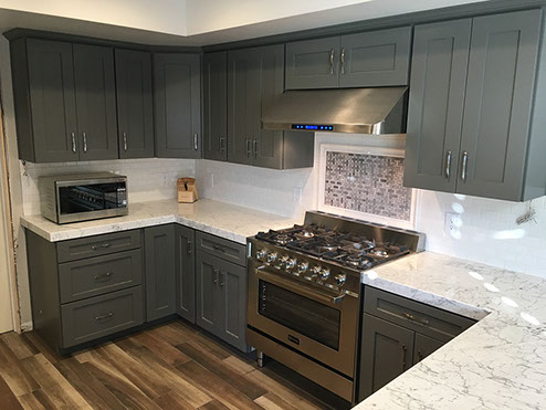 Frameless Alder Kitchen with Shaker Style doors with a Merlot Lacquer Finish
