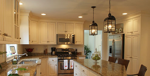 Traditional beaded inset paint grade kitchen, with a swiss coffee lacquer finsh.