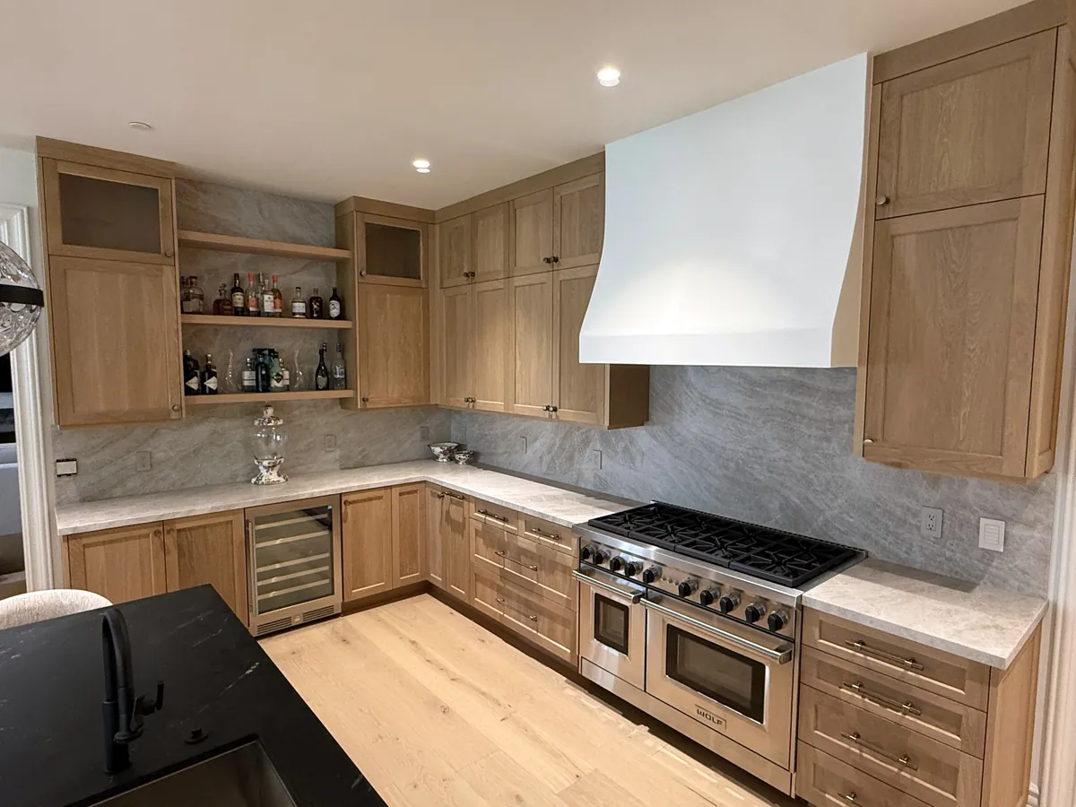 Oak shaker kitchen with a white range hood, open shelves and a wine fridge, Thousand Oaks