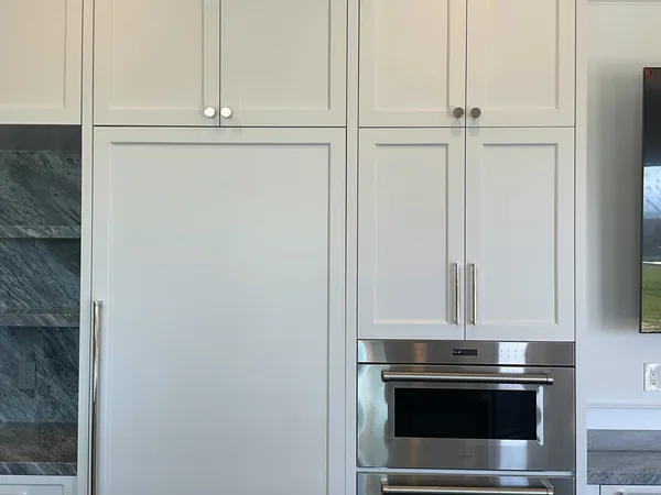 White shaker refrigerator and oven wall with tall upper cabinets, Calabasas