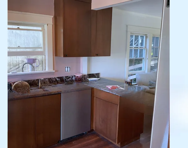 Stained wood sink run with granite counters and a stainless dishwasher, Moorpark
