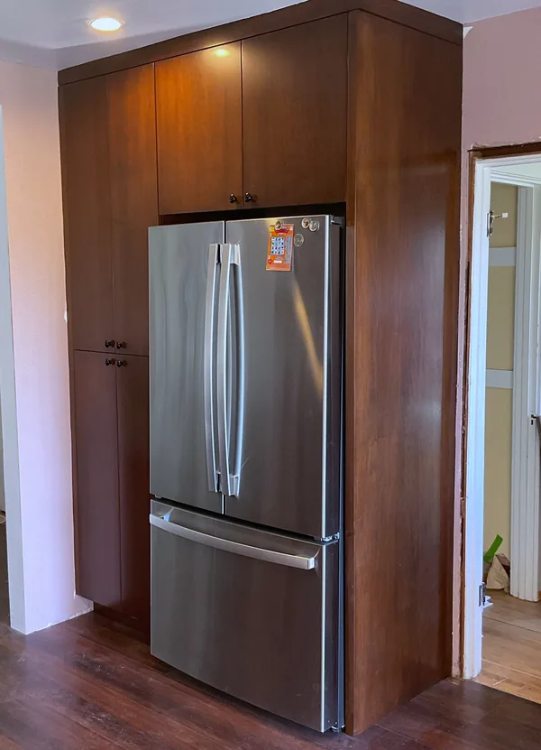 Tall stained wood pantry and refrigerator surround, Moorpark