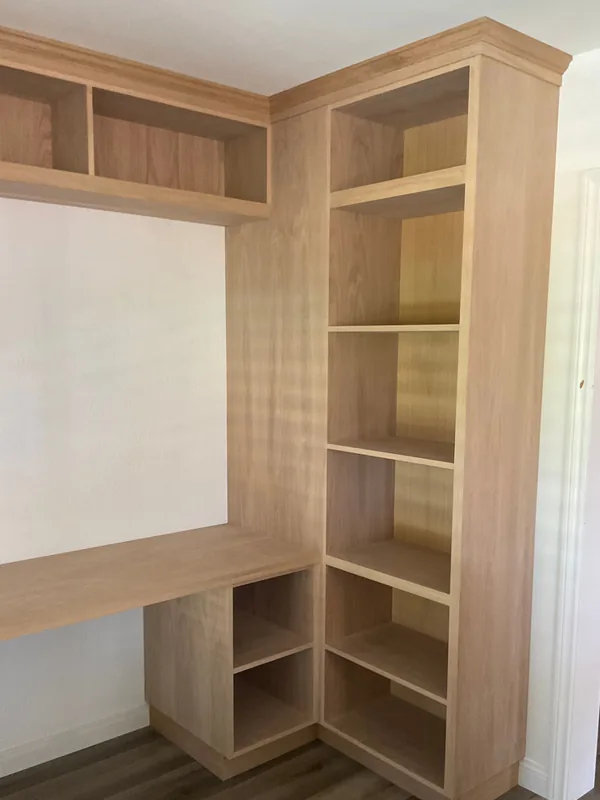 Light oak corner bookcase meeting a built-in desk, Agoura Hills