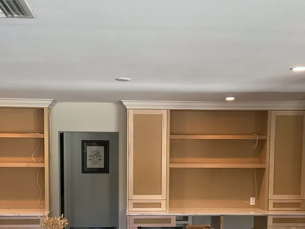 Light wood built-in desk wall with open bookshelves, Newbury Park