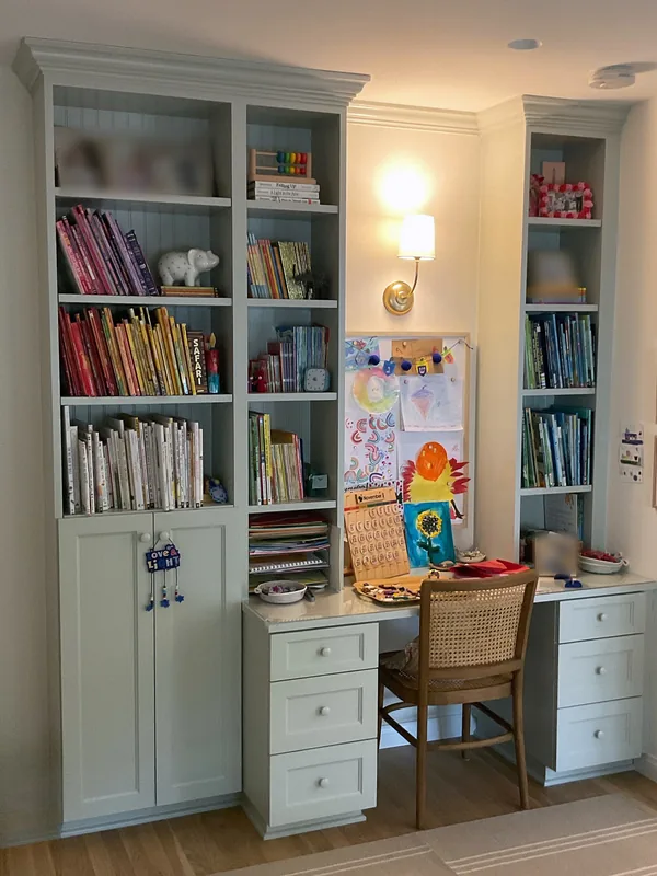 Mint green built-in desk between two bookcase towers, Los Angeles