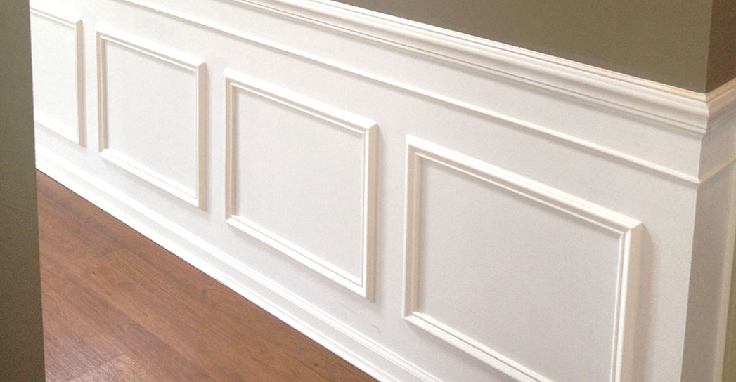 Custom Paint Grade Wainscoting and Crown Molding with a Swiss Coffee Lacquer Finish.