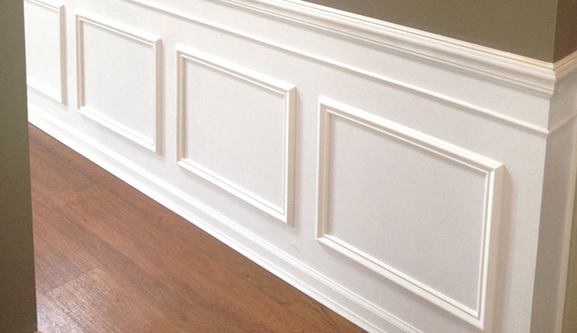 Custom Paint Grade Wainscoting and Crown Molding with a Swiss Coffee Lacquer Finish.