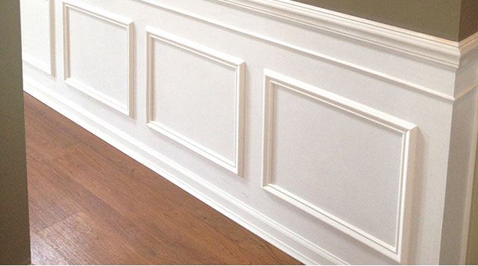 Custom Paint Grade Wainscoting and Crown Molding with a Swiss Coffee Lacquer Finish.
