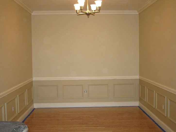 Custom Paint Grade Wainscoting and Crown Molding with a Swiss Coffee Lacquer Finish.