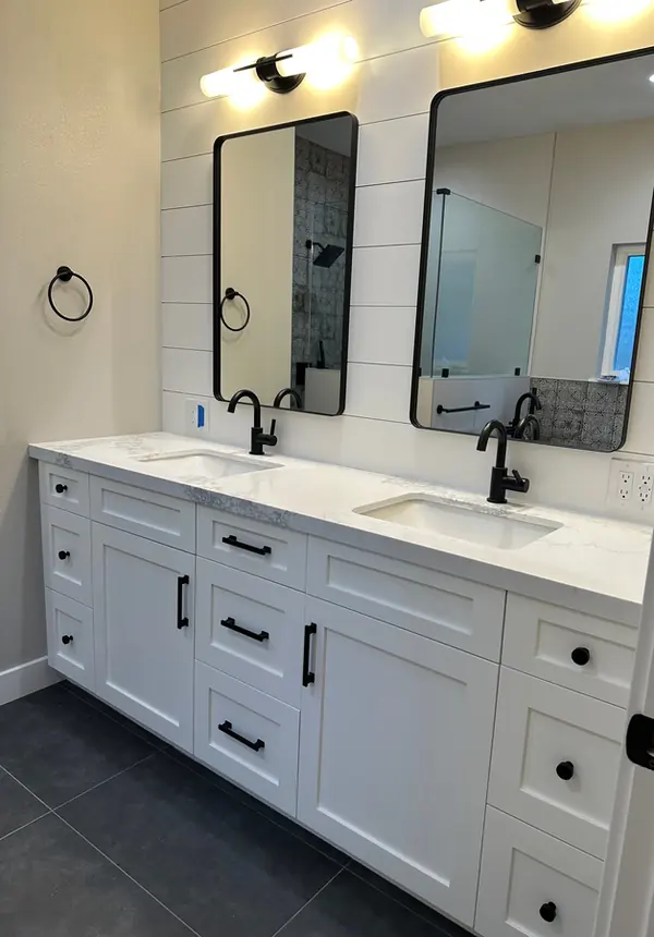 White double vanity with black hardware against a shiplap wall, Thousand Oaks