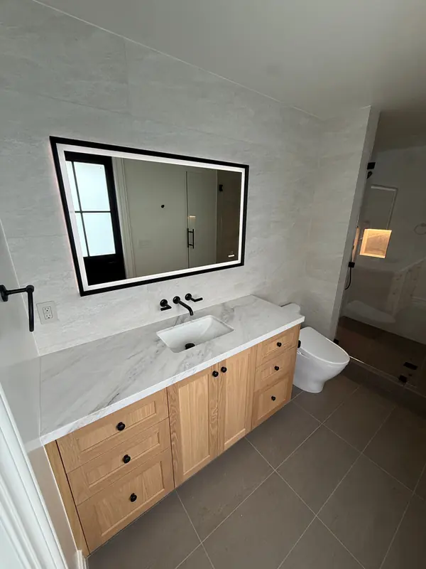 Oak shaker vanity under a backlit mirror, Thousand Oaks